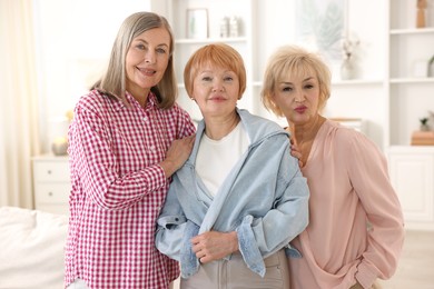 Photo of Friendship. Portrait of senior women at home