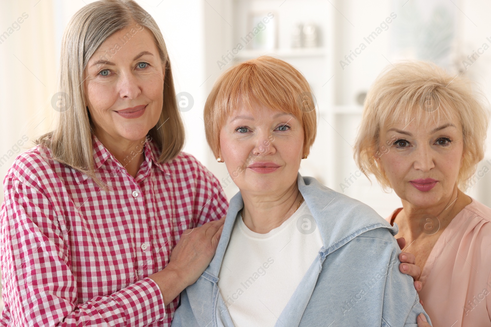 Photo of Friendship. Portrait of senior women at home