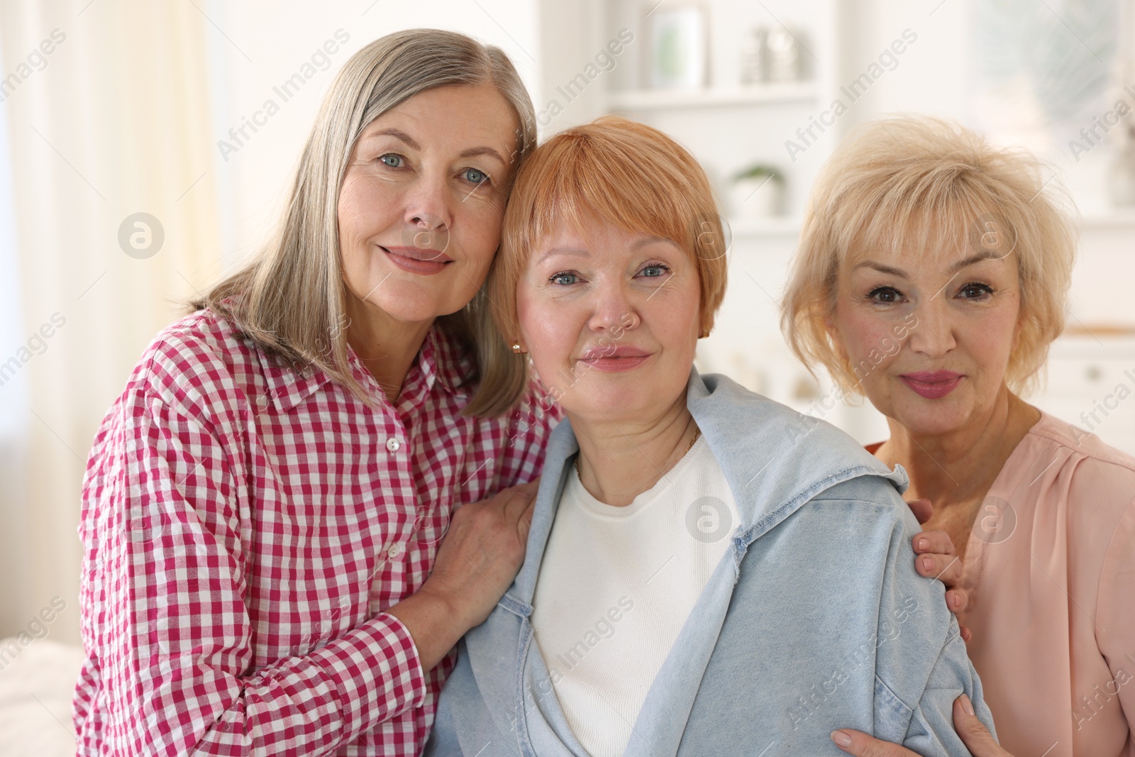 Photo of Friendship. Portrait of senior women at home