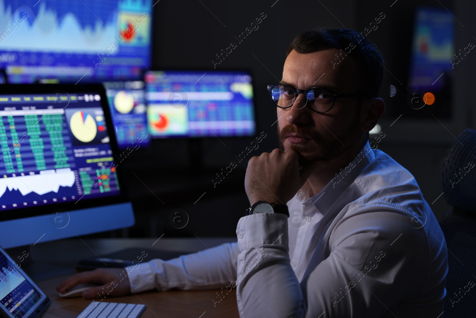 Photo of Portrait of financial trading specialist in office at night