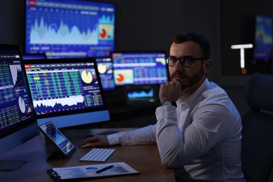 Photo of Portrait of financial trading specialist in office at night