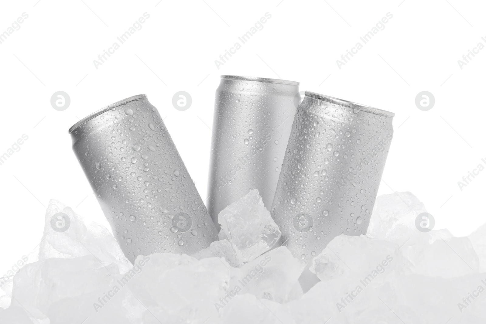 Refreshing drinks in cans on ice cubes against white background Photo of Refreshing drinks in cans on ice cubes against white background