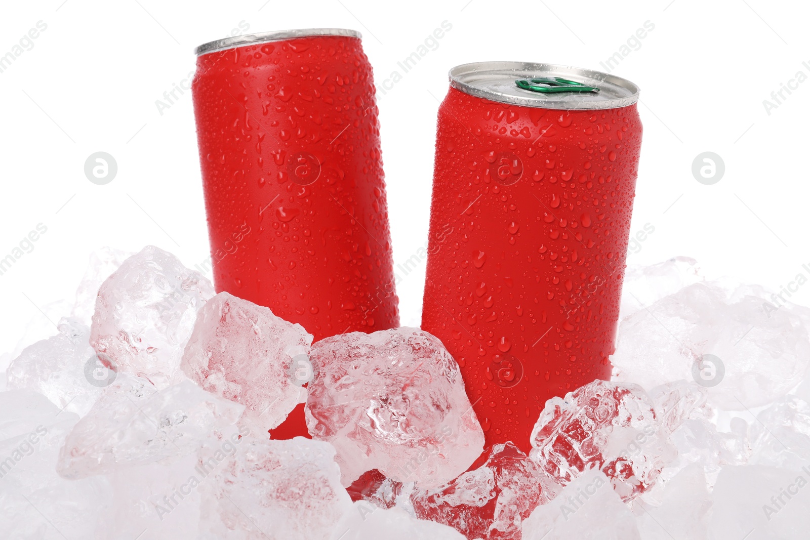 Refreshing drinks in cans on ice cubes against white background Photo of Refreshing drinks in cans on ice cubes against white background