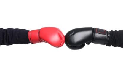 Photo of Business competition. Women in gloves boxing on white background, closeup