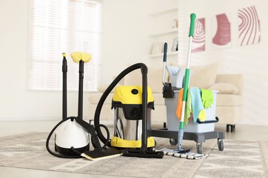 Photo of Professional cleaning appliances and supplies at home