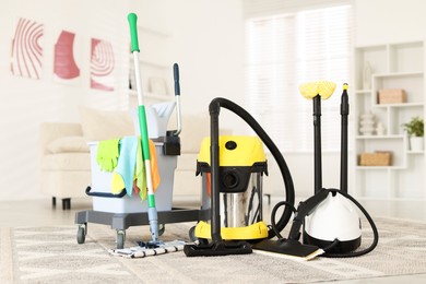 Photo of Professional cleaning appliances and supplies at home