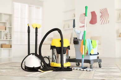 Photo of Professional cleaning appliances and supplies at home