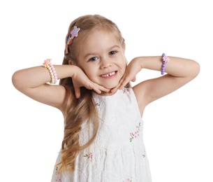 Photo of Cute little girl with beautiful hair clips on white background