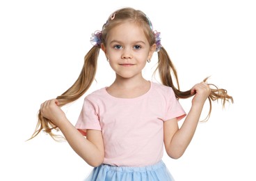 Photo of Cute little girl wearing beautiful hair accessories on white background