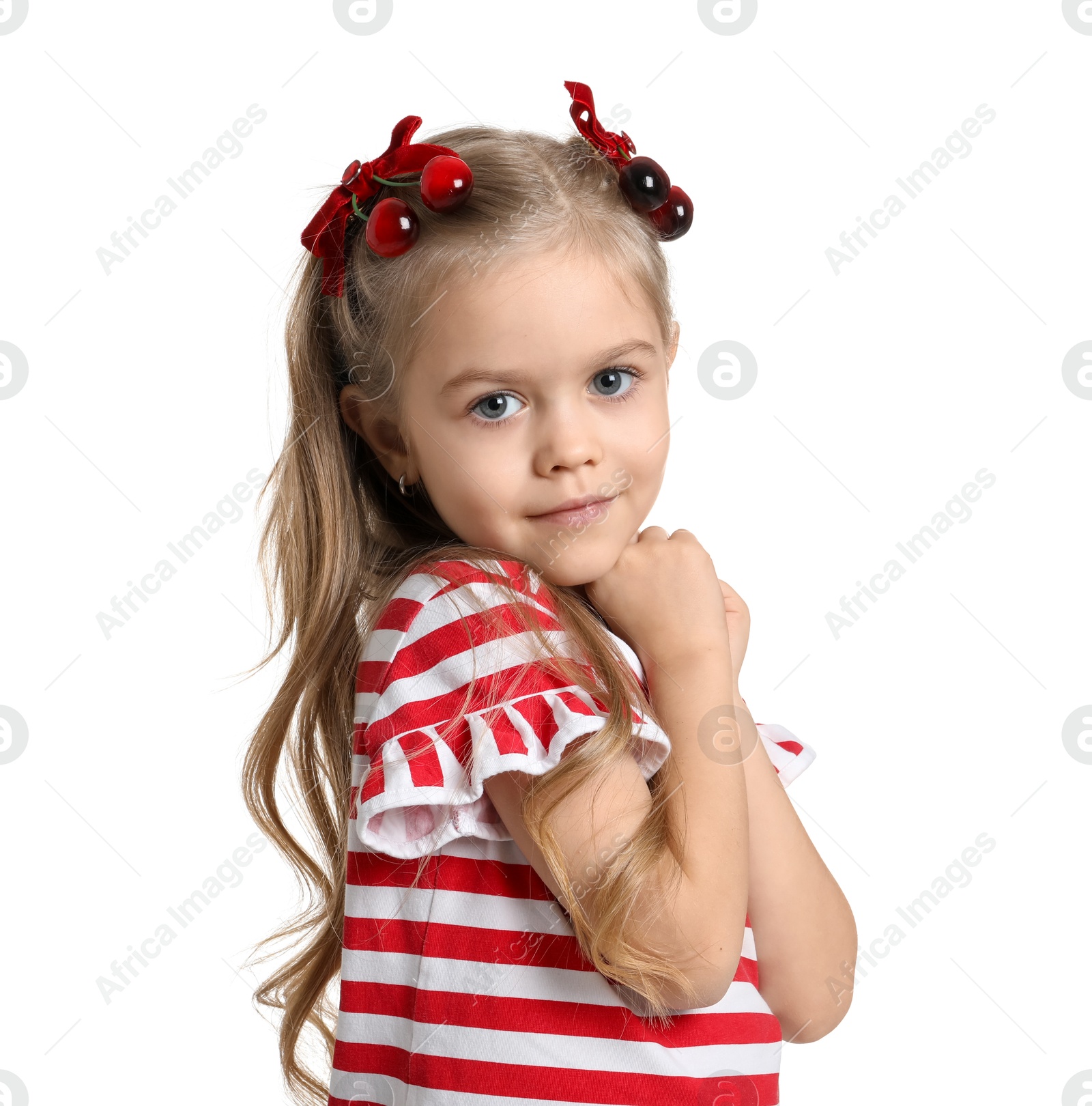 Photo of Cute little girl wearing beautiful bows with cherries on white background