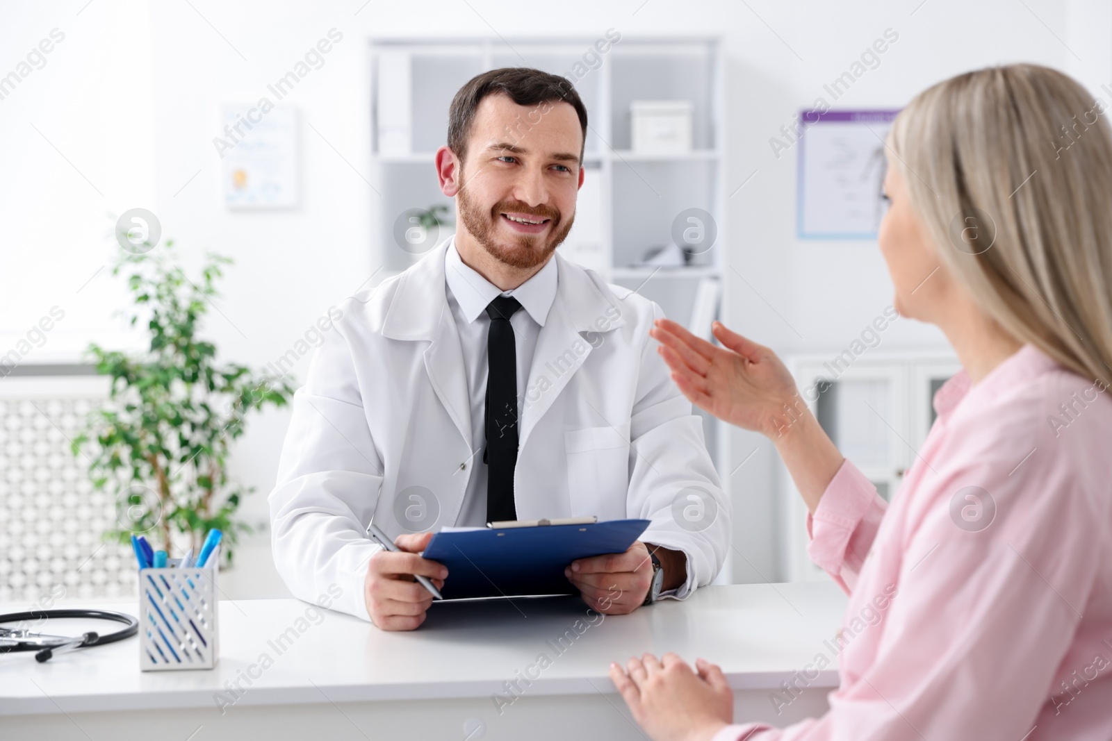 Photo of Woman having appointment with doctor in hospital