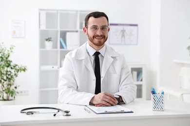 Photo of Professional doctor working at desk in hospital