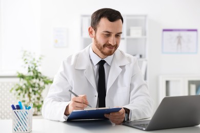 Photo of Professional doctor working at desk in hospital