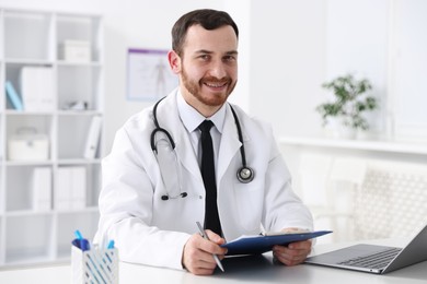 Photo of Professional doctor working at desk in hospital