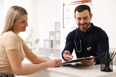 Photo of Woman having appointment with doctor in hospital