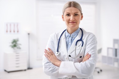 Photo of Portrait of professional doctor with stethoscope in hospital. Space for text