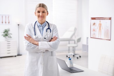 Photo of Portrait of professional doctor with stethoscope in hospital. Space for text