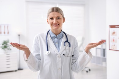 Photo of Portrait of professional doctor with stethoscope in hospital