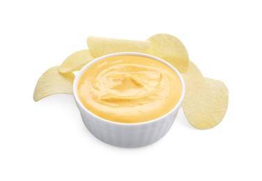 Photo of Tasty cheese dipping sauce in bowl and potato chips isolated on white
