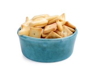 Photo of Crackers with tasty cheese sauce in bowl isolated on white