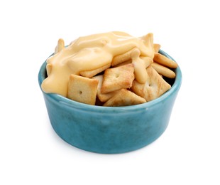 Photo of Crackers with tasty cheese sauce in bowl isolated on white