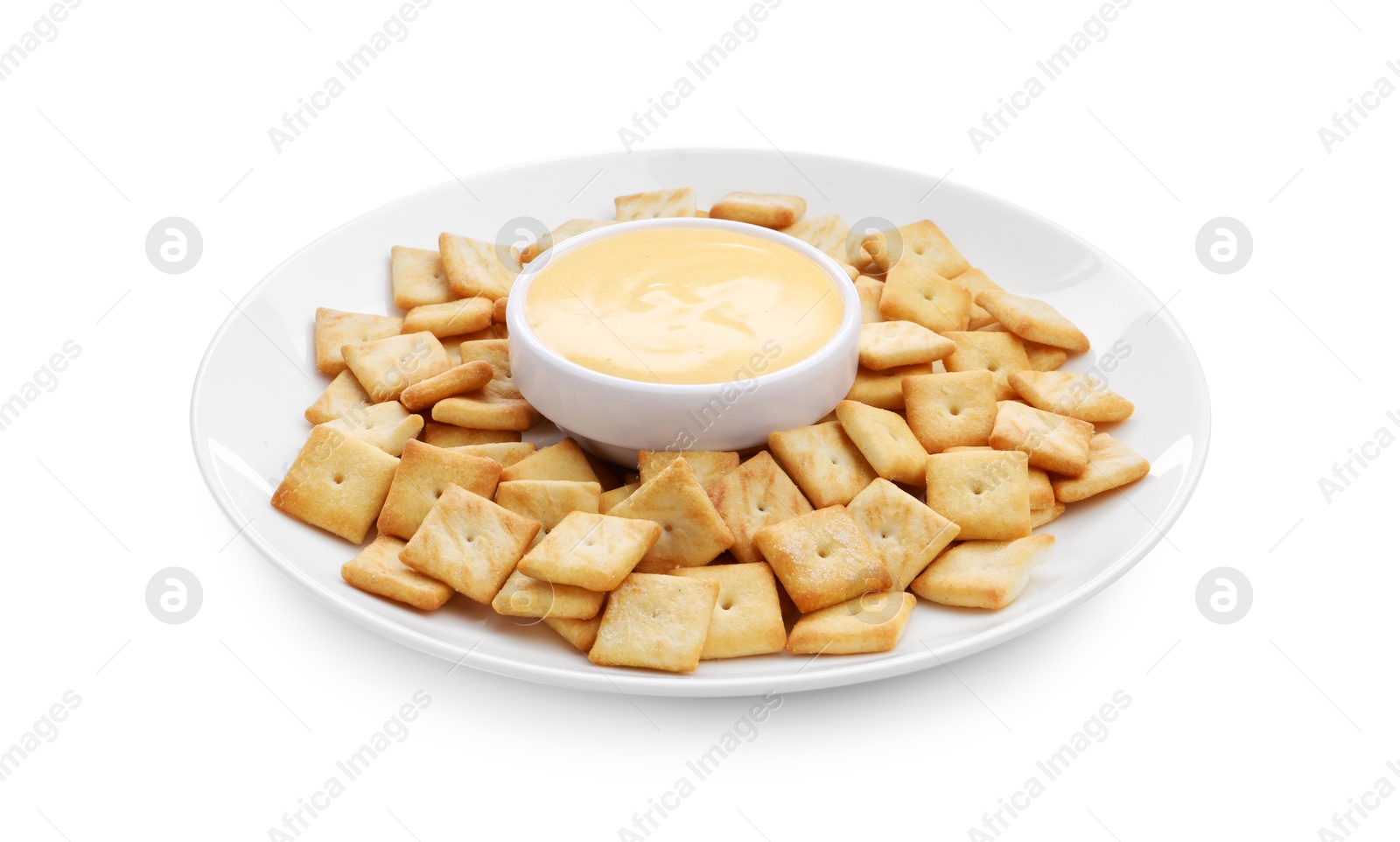 Photo of Tasty cheese dipping sauce in bowl and crackers isolated on white