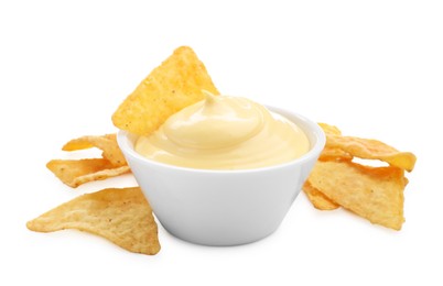 Photo of Tasty cheese dipping sauce in bowl and nacho chips isolated on white