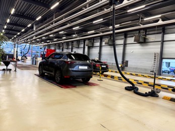 Photo of Modern cars undergoing procedure of vehicle inspection at station