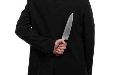 Photo of Businessman holding knife behind his back on white background, closeup