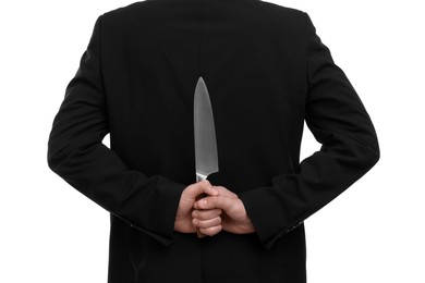 Photo of Businessman holding knife behind his back on white background, closeup