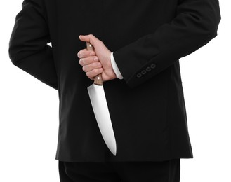 Photo of Businessman holding knife behind his back on white background, closeup