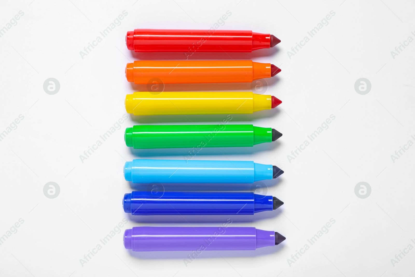 Photo of Many colorful markers on white background, flat lay