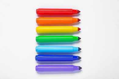Photo of Many colorful markers on white background, flat lay