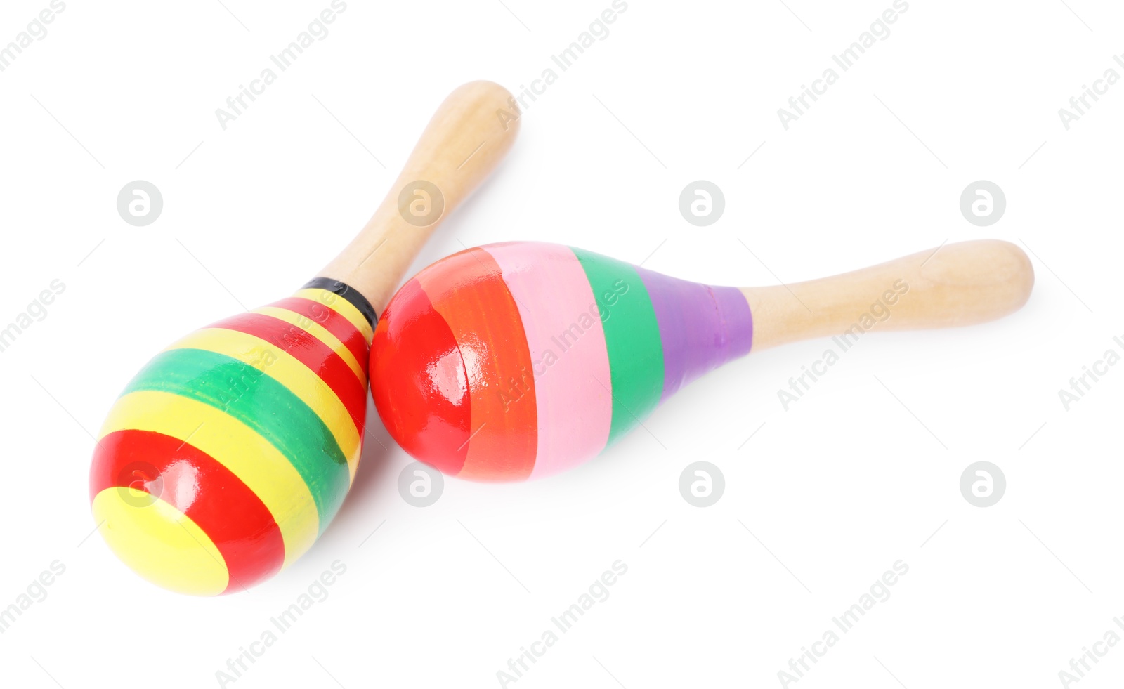 Photo of Colorful toy maracas isolated on white. Child's musical instrument