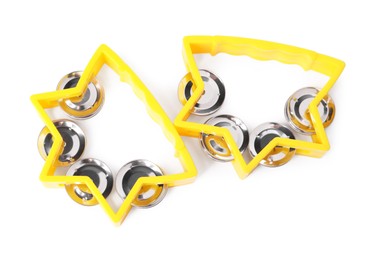 Photo of Yellow toy tambourines isolated on white, top view. Child's musical instrument