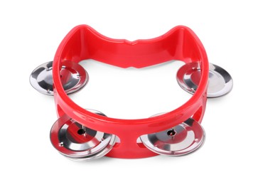 Red toy tambourine isolated on white. Child's musical instrument