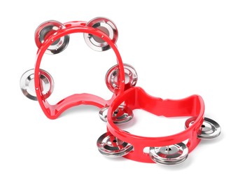 Red toy tambourines isolated on white. Child's musical instrument