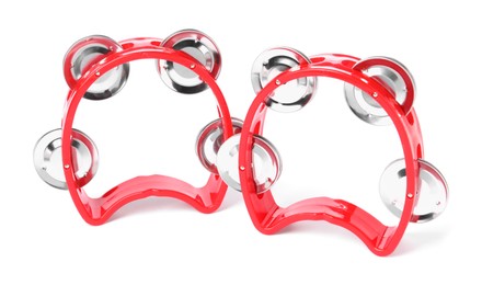 Red toy tambourines isolated on white. Child's musical instrument