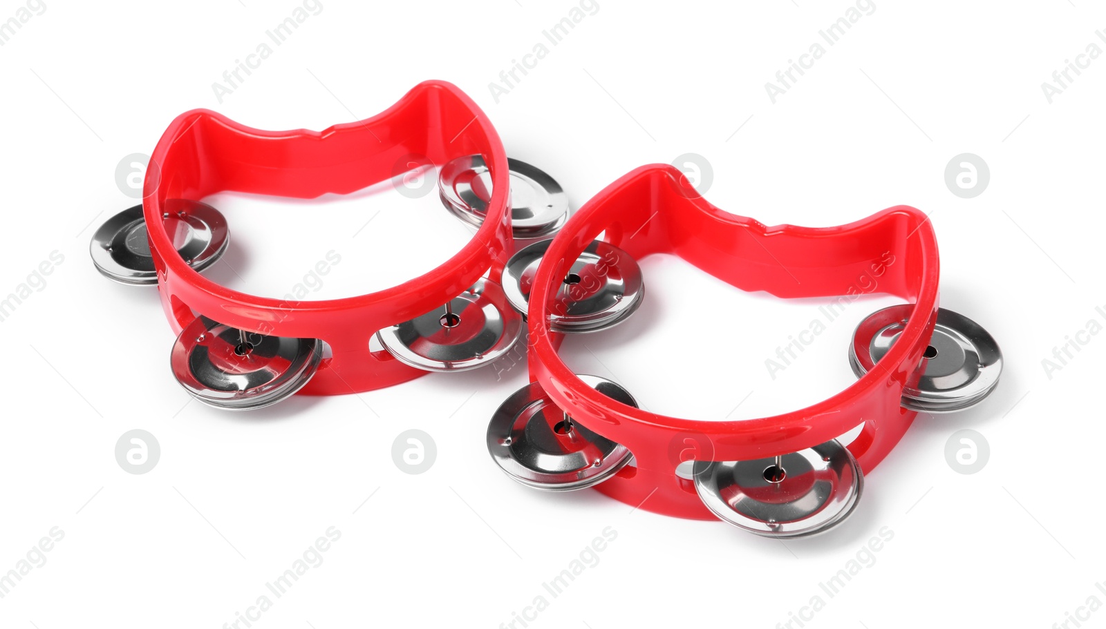 Photo of Red toy tambourines isolated on white. Child's musical instrument