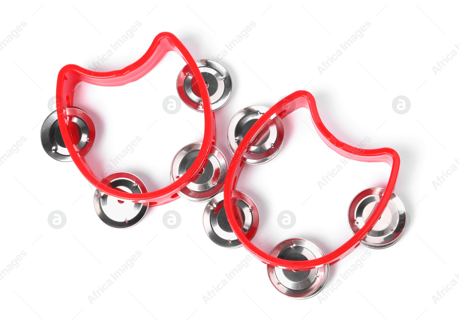 Photo of Red toy tambourines isolated on white, top view. Child's musical instrument