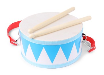 Toy drum with drumsticks isolated on white. Child's musical instrument