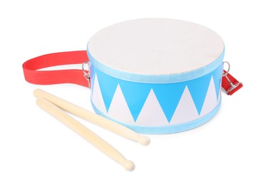 Photo of Toy drum with drumsticks isolated on white. Child's musical instrument