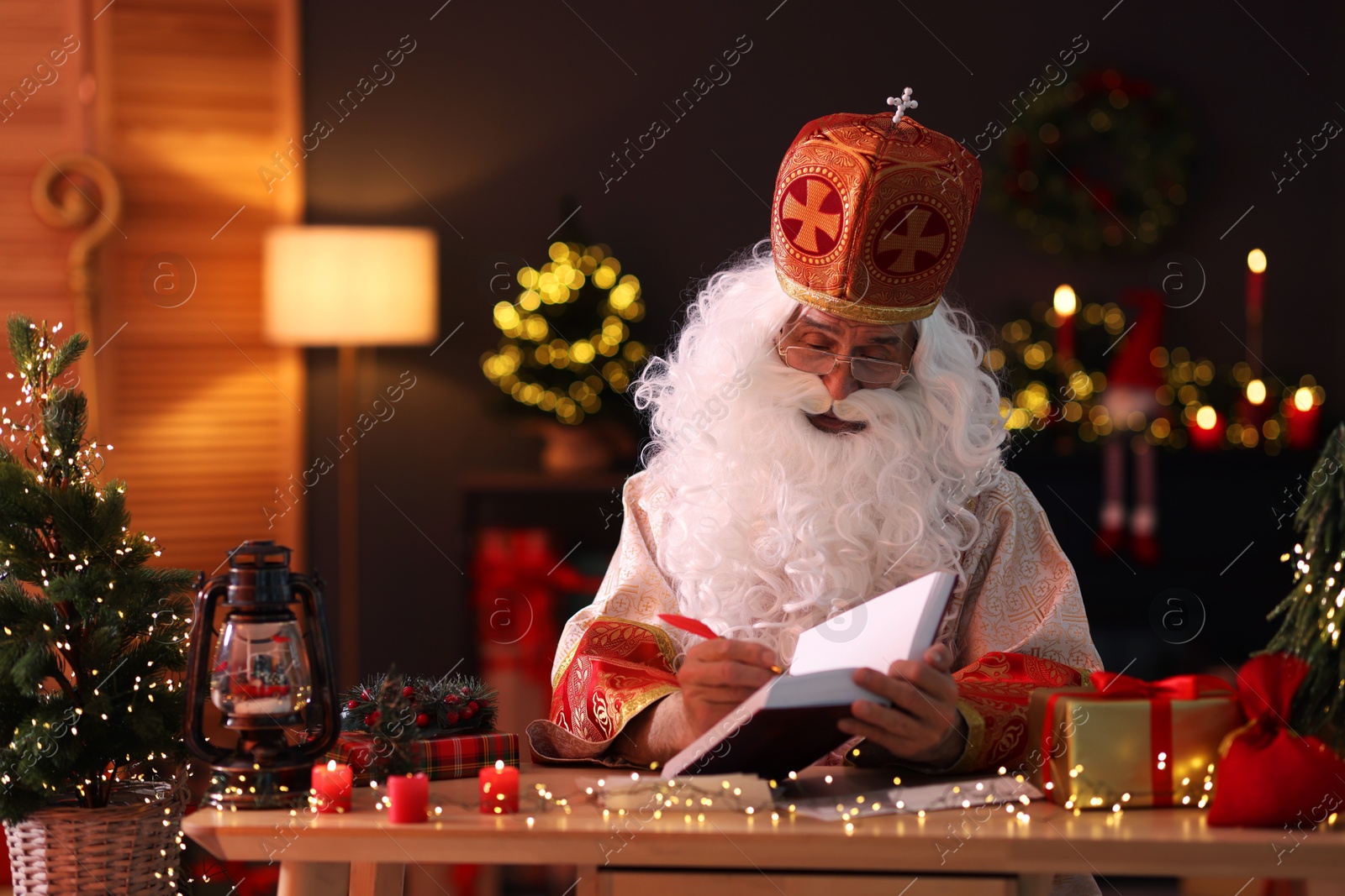 Photo of Saint Nicholas in room decorated for Christmas