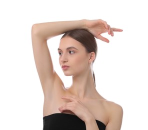 Photo of Young woman showing smooth skin after epilation on white background