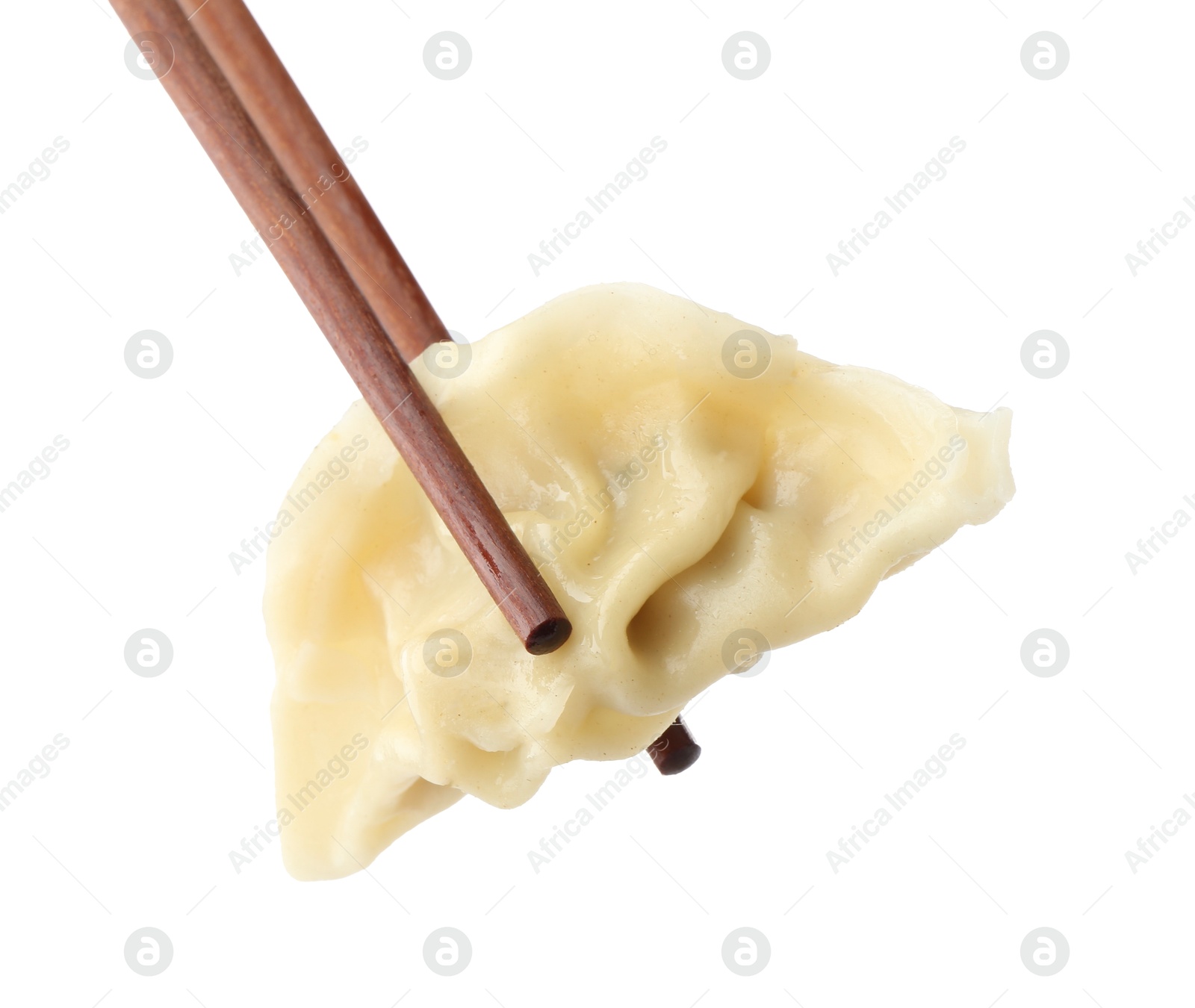 Photo of Chopsticks with tasty boiled gyoza (dumpling) on white background