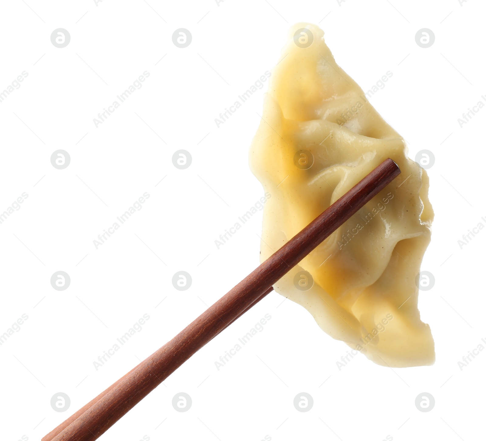 Photo of Chopsticks with tasty boiled gyoza (dumpling) on white background