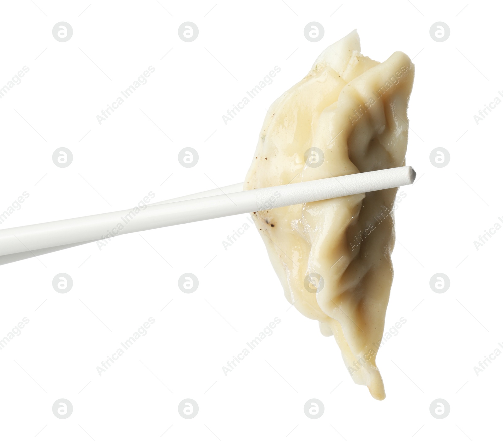 Photo of Chopsticks with tasty boiled gyoza (dumpling) on white background