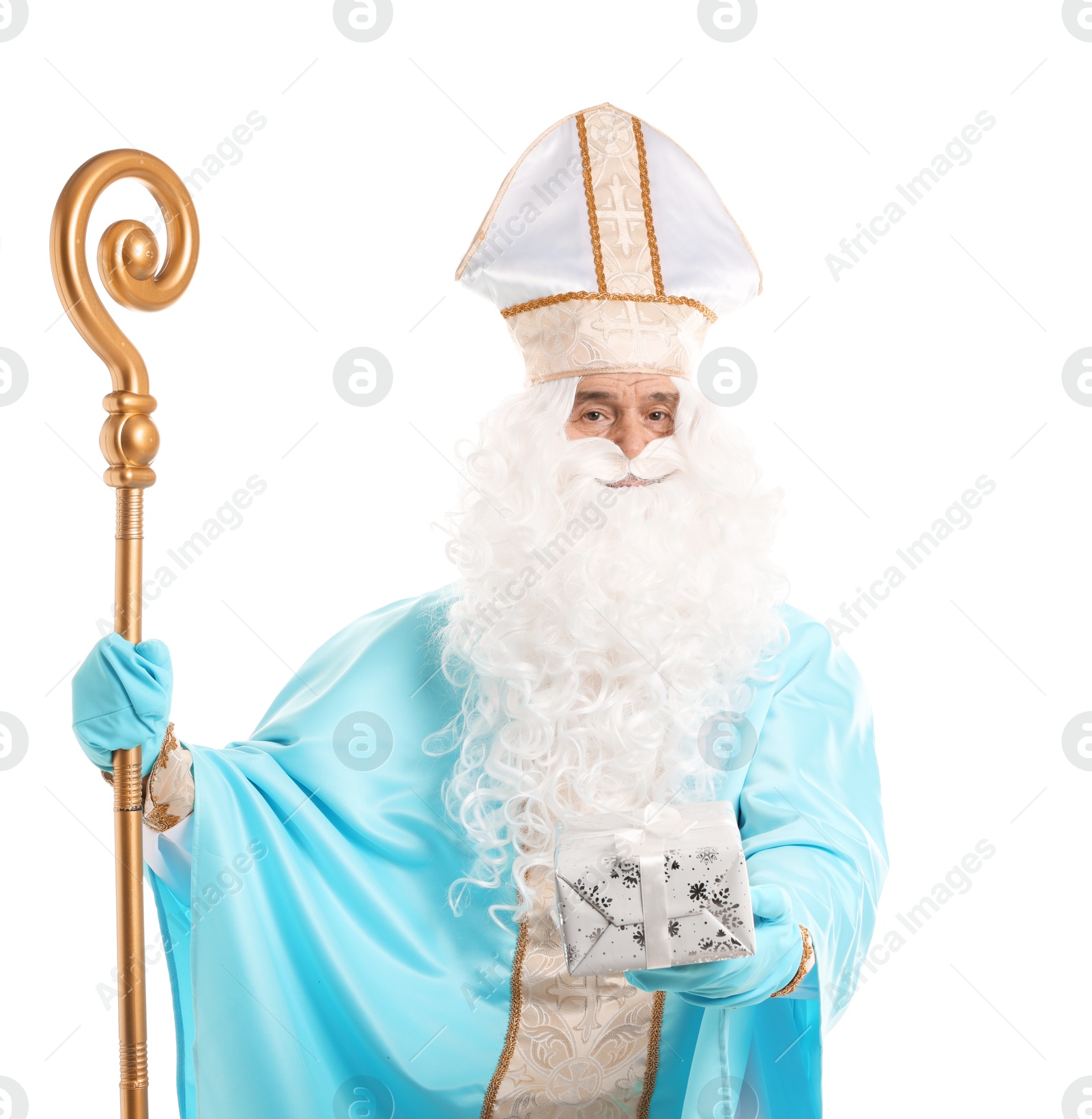 Photo of Saint Nicholas with Christmas gift and crozier on white background