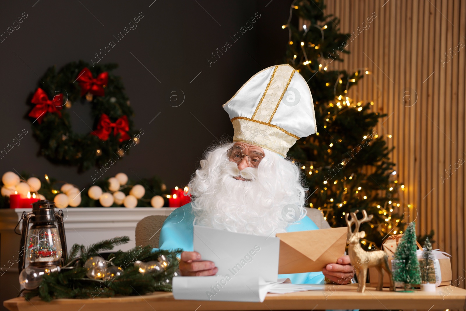 Photo of Saint Nicholas with letters in room decorated for Christmas