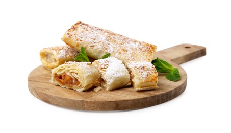 Photo of Tasty apple strudels with powdered sugar and mint isolated on white